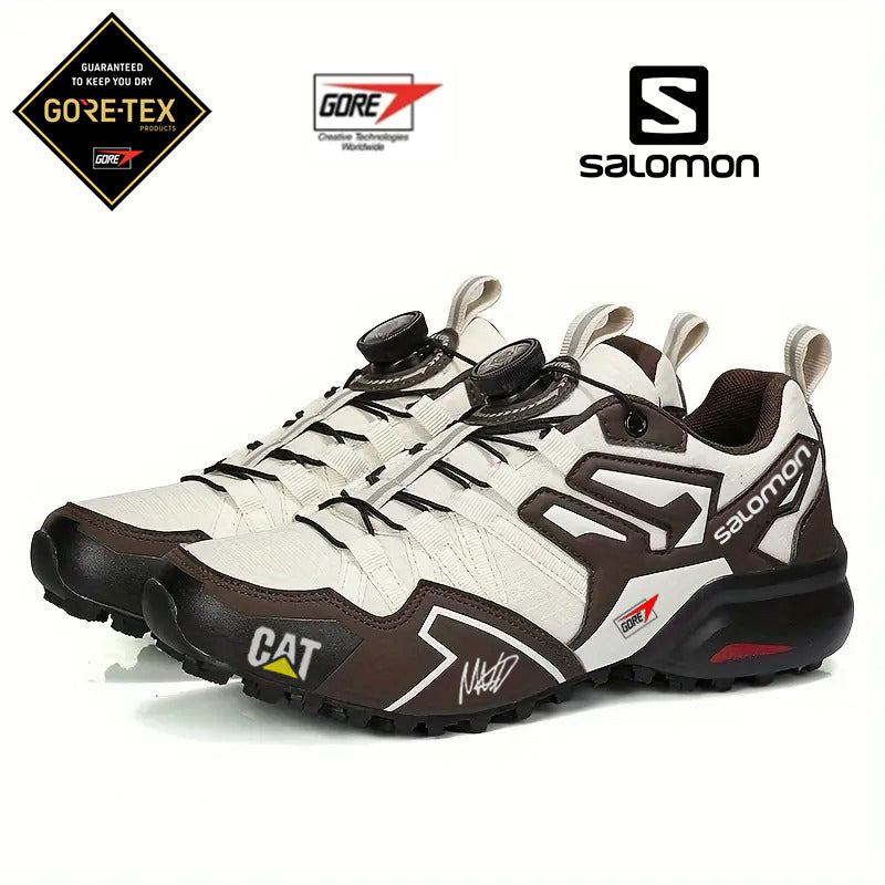 Vízálló GTX túracipő CAT és Salomon márkától, kényelmes és kopásálló (limitált kiadás F1-es pilóta aláírásával)