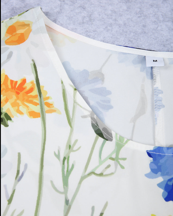 Sárga és kék virágos rövid ujjú és fehér pliszírozott midi ruha